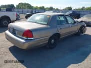 ✅ 2001 Ford Crown Victoria • VIN: 2FAFP73W01X131209 • Lot: 43033250. Listed on IAAI with 241,898 mi. Free auction sales archive from the USA and detailed vehicle history report at DreamBid. Image 4.