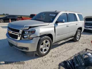 2015 Chevrolet Tahoe LS with VIN 1GNSCAKC5FR308869, listed as a Copart auction lot 72003065 with 116,502 mi miles and Salvage title. Bid and sale history available at DreamBid. Image 1.