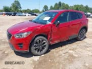 ✅ 2016 Mazda CX-5 Grand Touring • VIN: JM3KE2DY5G0796669 • Lot: 42168522. Wystawiony na IAAI z przebiegiem 147 914 mil. Bezpłatny archiwum sprzedaży aukcyjnych z USA i szczegółowy raport historii pojazdu na DreamBid. Zdjęcie 2.