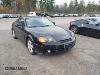 2003 Hyundai Tiburon GT z VIN KMHHN65F53U059705, wystawiony jako IAAI lot #43573043 z przebiegiem 165 650 mil mil oraz . Historia ofert i sprzedaży dostępna na DreamBid. Obrazek 1.
