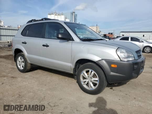 2009 Hyundai Tucson GLS with VIN KM8JM12B79U012399, listed as a Copart auction lot 77663414 with 164,615 mi miles and Salvage title. Bid and sale history available at DreamBid. Image 4.