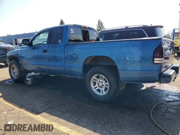 2002 Dodge Dakota Sport z VIN 1B7GG32NX2S616395, wystawiony jako Copart lot #70294944 z przebiegiem 205 067 mil mil oraz Czysty tytuł • Clean title. Historia ofert i sprzedaży dostępna na DreamBid. Obrazek 2.