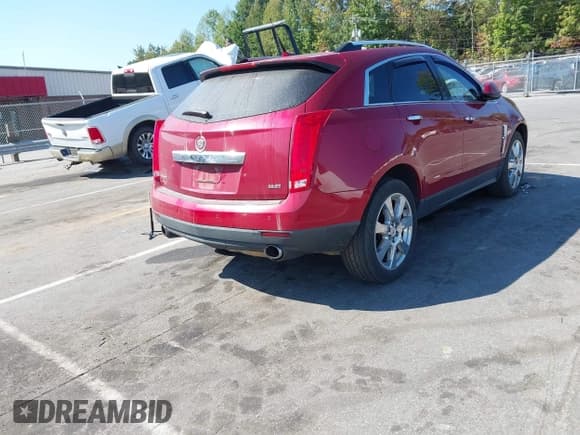 ✅ 2012 Cadillac SRX Performance Collection • VIN: 3GYFNBE31CS571210 • Lot: 43251543. Listed on IAAI with 186,568 mi. Free auction sales archive from the USA and detailed vehicle history report at DreamBid. Image 4.