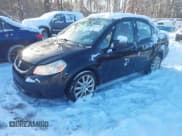 ✅ 2011 Suzuki SX4 LE • VIN: JS2YC5A24B6300895 • Lot: 43832054. Wystawiony na IAAI z przebiegiem 149 126 mil. Bezpłatny archiwum sprzedaży aukcyjnych z USA i szczegółowy raport historii pojazdu na DreamBid. Zdjęcie 2.