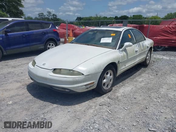 ✅ 1999 Oldsmobile Aurora • VIN: 1G3GR62CXX4100897 • Lot: 42277912. Wystawiony na IAAI z przebiegiem 179 680 mil. Bezpłatny archiwum sprzedaży aukcyjnych z USA i szczegółowy raport historii pojazdu na DreamBid. Zdjęcie 2.