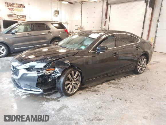 ✅ 2018 Mazda 6 Grand Touring Reserve • VIN: JM1GL1WY6J1314014 • Lot: 43419787. Listed on IAAI with 80,754 mi. Free auction sales archive from the USA and detailed vehicle history report at DreamBid. Image 2.