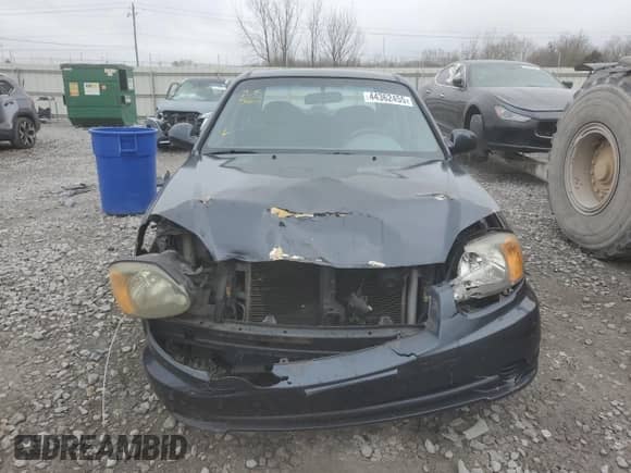 2005 Hyundai Accent GLS с VIN KMHCG45C85U671205, выставлен на аукционе Copart как лот 44362455 с пробегом 93 032 миль миль и Списание • Salvage title. История ставок и продаж доступна на DreamBid. Изображение 5.