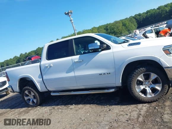 ✅ 2021 Ram 1500 Laramie • VIN: 1C6RREJT4MN630316 • Lot: 42844637. Listed on IAAI with 116,198 mi. Free auction sales archive from the USA and detailed vehicle history report at DreamBid. Image 13.