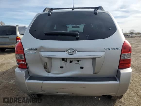 2009 Hyundai Tucson GLS with VIN KM8JM12B79U012399, listed as a Copart auction lot 77663414 with 164,615 mi miles and Salvage title. Bid and sale history available at DreamBid. Image 6.