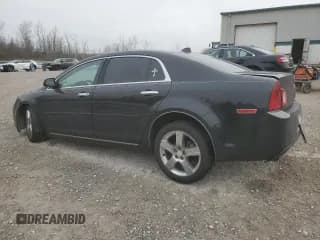 ✅ 2012 Chevrolet Malibu 1LT • VIN: 1G1ZC5E06CF256562 • Lot: 80766064. Listed on Copart with 141,567 mi. Free auction sales archive from the USA and detailed vehicle history report at DreamBid. Image 2.