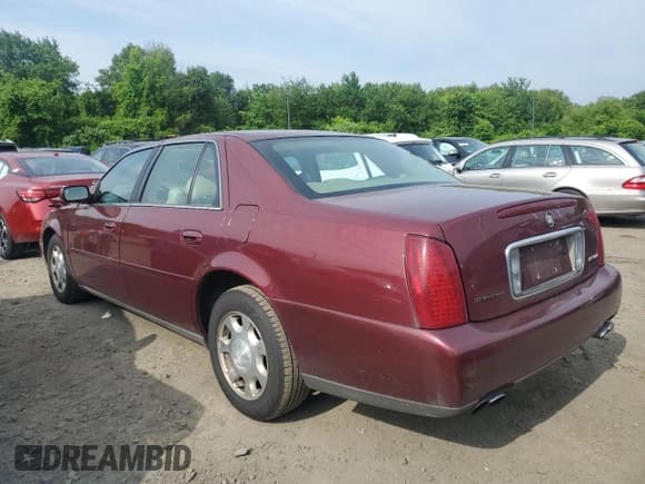 ✅ 2001 Cadillac DeVille • VIN: 1G6KD54Y51U268534 • Lot: 60542015. Listed on Copart with 100,712 mi. Free auction sales archive from the USA and detailed vehicle history report at DreamBid. Image 2.