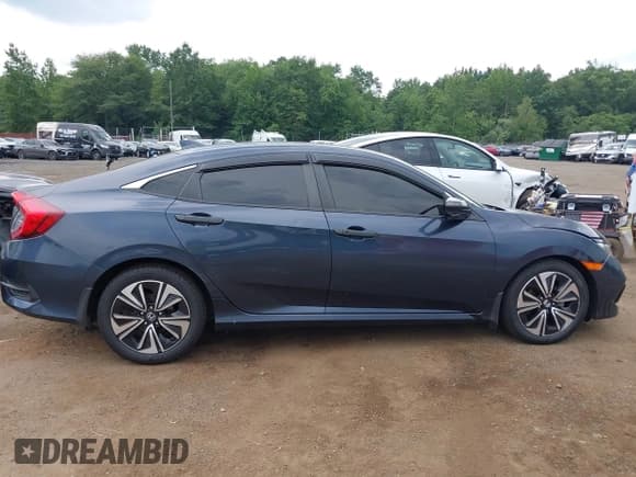 ✅ 2018 Honda Civic EX-T • VIN: JHMFC1F34JX037438 • Lot: 42887459. Listed on IAAI with 107,302 mi. Free auction sales archive from the USA and detailed vehicle history report at DreamBid. Image 18.