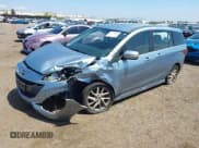 ✅ 2013 Mazda 5 Touring • VIN: JM1CW2CL8D0145628 • Lot: 42148184. Listed on IAAI with 137,150 mi. Free auction sales archive from the USA and detailed vehicle history report at DreamBid. Image 2.