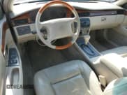 ✅ 2000 Cadillac Eldorado • VIN: 1G6EL12Y2YU151886 • Lot: 65156625. Wystawiony na Copart z przebiegiem 81 430 mil. Bezpłatny archiwum sprzedaży aukcyjnych z USA i szczegółowy raport historii pojazdu na DreamBid. Zdjęcie 8.