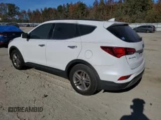 ✅ 2018 Hyundai Santa Fe 2.4L • VIN: 5NMZUDLB4JH057108 • Лот: 76108763. Опубликован ранее на Copart с пробегом 74 542 миль. Бесплатный доступ к архиву аукционных продаж из США и подробный отчёт об истории автомобиля на DreamBid. Изображение 2.