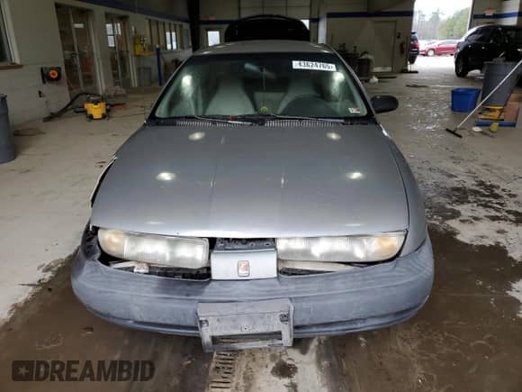1998 Saturn SL z VIN 1G8ZF5285WZ204569, wystawiony jako Copart lot #43624765 z przebiegiem 318 544 mil mil oraz Szkoda całkowita • Salvage title. Historia ofert i sprzedaży dostępna na DreamBid. Obrazek 5.