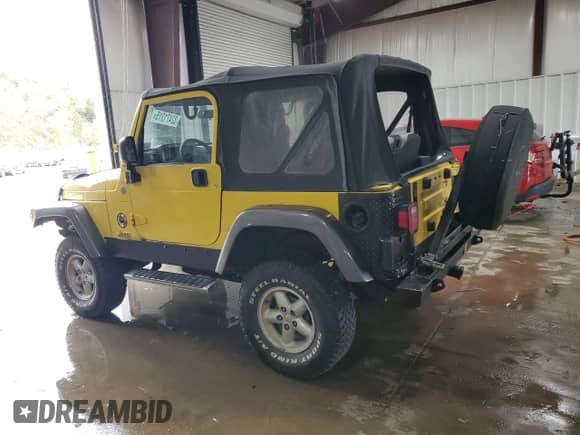 2004 Jeep Wrangler X with VIN 1J4FA39S24P739178, listed as a Copart auction lot 82471315 with 156,568 mi miles and Clean title. Bid and sale history available at DreamBid. Image 2.