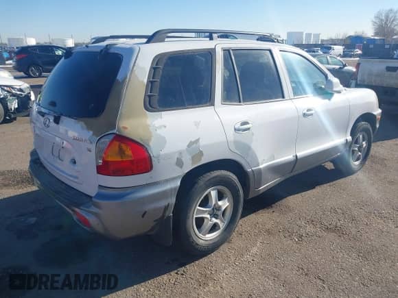 2003 Hyundai Santa Fe GLS z VIN KM8SC13D33U353605, wystawiony jako IAAI lot #41446295 z przebiegiem 175 875 mil mil oraz . Historia ofert i sprzedaży dostępna na DreamBid. Obrazek 4.