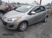 ✅ 2012 Mazda 2 Sport • VIN: JM1DE1KZ2C0145209 • Lot: 43779983. Listed on IAAI with 74,127 mi. Free auction sales archive from the USA and detailed vehicle history report at DreamBid. Image 2.