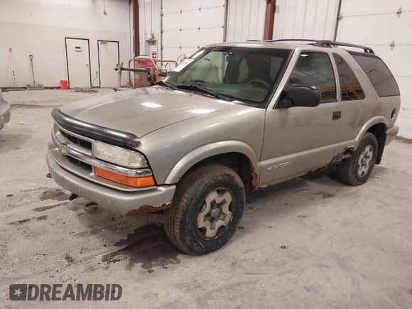 2004 Chevrolet Blazer LS with VIN 1GNCT18X64K126098, listed as a IAAI auction lot 41744502 with 26 mi miles and . Bid and sale history available at DreamBid. Image 2.