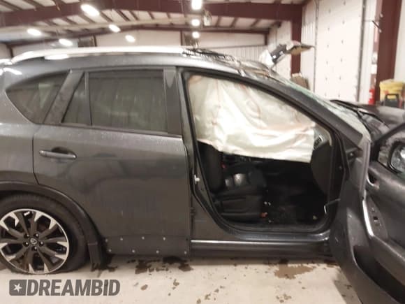 ✅ 2016 Mazda CX-5 Grand Touring • VIN: JM3KE4DY4G0679077 • Lot: 43560857. Wystawiony na IAAI z przebiegiem 83 348 mil. Bezpłatny archiwum sprzedaży aukcyjnych z USA i szczegółowy raport historii pojazdu na DreamBid. Zdjęcie 14.