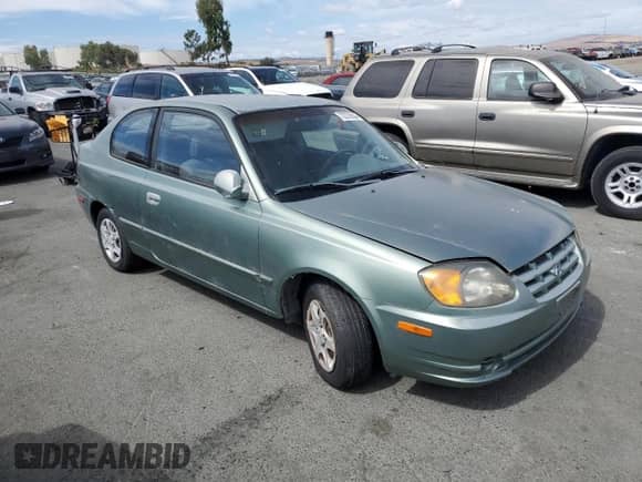 2003 Hyundai Accent GL с VIN KMHCG35C13U277732, выставлен на аукционе Copart как лот 72276634 с пробегом 135 176 миль миль и Списание • Salvage title. История ставок и продаж доступна на DreamBid. Изображение 4.