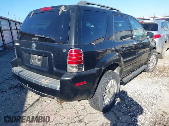 2005 Mercury Mariner Luxury z VIN 4M2YU561X5DJ15381, wystawiony jako IAAI lot #41295590 z przebiegiem 215 077 mil mil oraz . Historia ofert i sprzedaży dostępna na DreamBid. Obrazek 4.