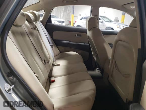 2009 Hyundai Elantra GLS z VIN KMHDU46D79U757051, wystawiony jako Copart lot #60498574 z przebiegiem 121 544 mil mil oraz Szkoda całkowita • Salvage title. Historia ofert i sprzedaży dostępna na DreamBid. Obrazek 10.