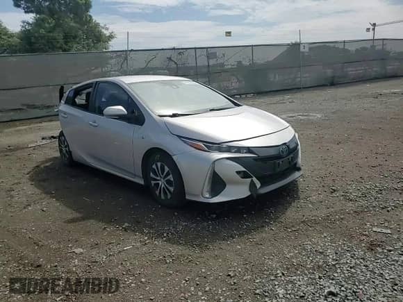 2021 Toyota Prius LE z VIN JTDKAMFP6M3186049, wystawiony jako Copart lot #81289905 z przebiegiem 271 061 mil mil oraz Szkoda całkowita • Salvage title. Historia ofert i sprzedaży dostępna na DreamBid. Obrazek 13.