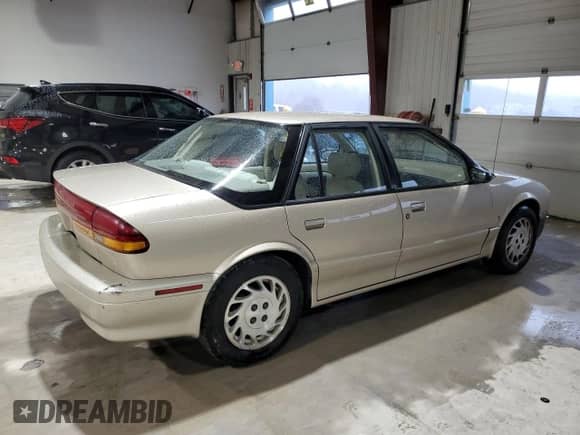 1995 Saturn SL с VIN 1G8ZK5271SZ238117, выставлен на аукционе Copart как лот 83723624 с пробегом 80 535 миль миль и Чистый • Clean title. История ставок и продаж доступна на DreamBid. Изображение 3.