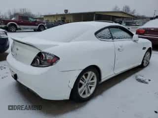 2007 Hyundai Tiburon GS z VIN KMHHM66D67U254976, wystawiony jako Copart lot #87434194 z przebiegiem Nie podano mil oraz Czysty tytuł • Clean title. Historia ofert i sprzedaży dostępna na DreamBid. Obrazek 3.