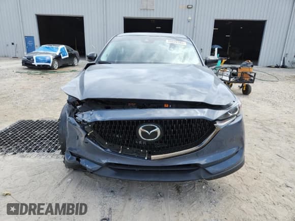 ✅ 2021 Mazda CX-5 Carbon Edition • VIN: JM3KFACM1M0395301 • Lot: 68020185. Wystawiony na Copart z przebiegiem 48 623 mil. Bezpłatny archiwum sprzedaży aukcyjnych z USA i szczegółowy raport historii pojazdu na DreamBid. Zdjęcie 5.