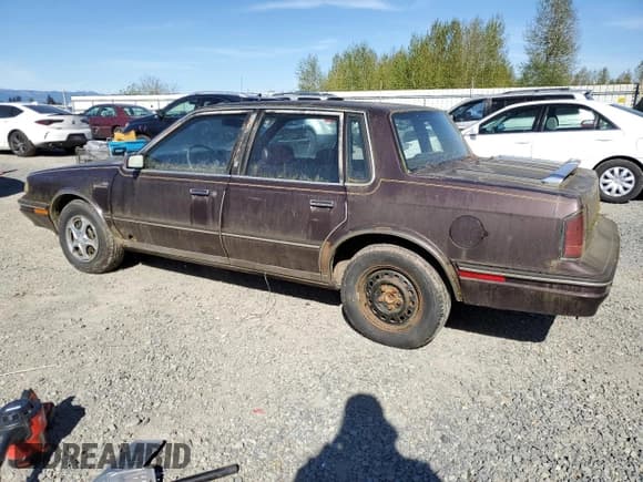 ✅ 1987 Oldsmobile Cutlass Ciera • VIN: 2G3AM51RXH9391582 • Lot: 53736795. Listed on Copart with 81,728 mi. Free auction sales archive from the USA and detailed vehicle history report at DreamBid. Image 2.