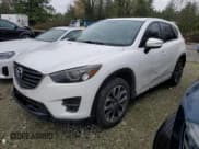 ✅ 2016 Mazda CX-5 Grand Touring • VIN: JM3KE4DY1G0803211 • Лот: 89537495. Опубликован ранее на Copart с пробегом 255 646 миль. Бесплатный доступ к архиву аукционных продаж из США и подробный отчёт об истории автомобиля на DreamBid. Изображение 1.
