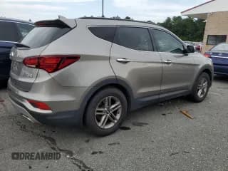 ✅ 2018 Hyundai Santa Fe 2.4L • VIN: 5NMZUDLB9JH103063 • Лот: 57506314. Опубликован ранее на Copart с пробегом 129 903 миль. Бесплатный доступ к архиву аукционных продаж из США и подробный отчёт об истории автомобиля на DreamBid. Изображение 3.