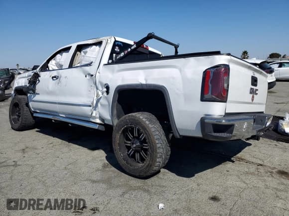 ✅ 2018 GMC Sierra 1500 SLT • VIN: 3GTU2NEJ6JG432860 • Лот: 82153505. Опубликован ранее на Copart с пробегом 96 981 миль. Бесплатный доступ к архиву аукционных продаж из США и подробный отчёт об истории автомобиля на DreamBid. Изображение 2.
