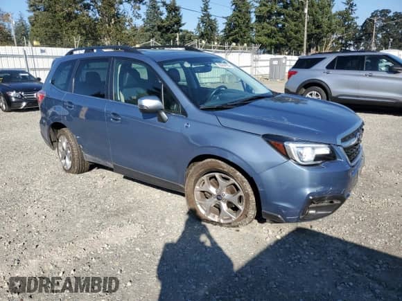 2018 Subaru Forester Touring with VIN JF2SJAWC4JH533194, listed as a Copart auction lot 85264165 with 115,027 mi miles and Salvage title. Bid and sale history available at DreamBid. Image 4.