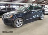 ✅ 2012 Volkswagen Touareg Sport • VIN: WVGEF9BP9CD011879 • Lot: 56903035. Listed on Copart with 198,262 mi. Free auction sales archive from the USA and detailed vehicle history report at DreamBid. Image 1.