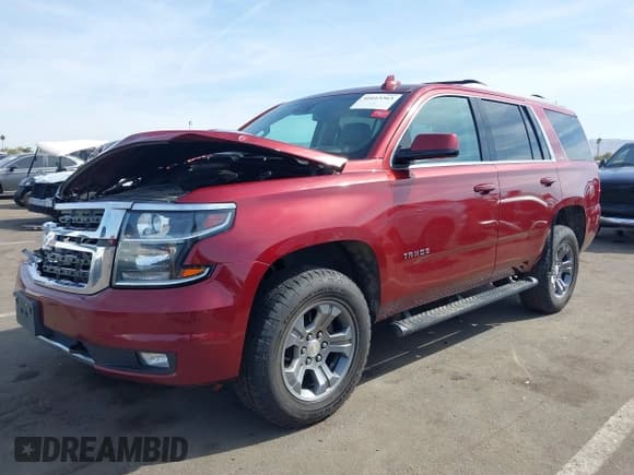 ✅ 2018 Chevrolet Tahoe LT • VIN: 1GNSKBKC0JR213007 • Lot: 41613263. Listed on IAAI with 137,537 mi. Free auction sales archive from the USA and detailed vehicle history report at DreamBid. Image 2.