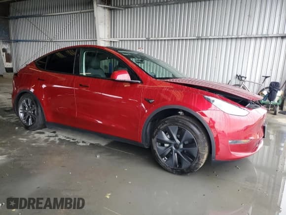 ✅ 2024 Tesla Model Y Long Range • VIN: 7SAYGAEE2RF153831 • Lot: 84552935. Listed on Copart with 29,832 mi. Free auction sales archive from the USA and detailed vehicle history report at DreamBid. Image 4.