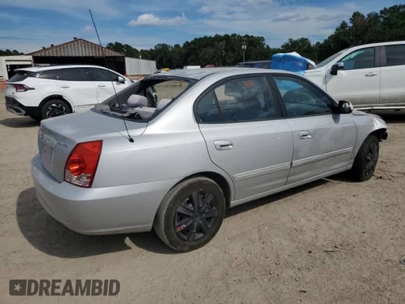 2004 Hyundai Elantra GLS with VIN KMHDN46D14U710703, listed as a Copart auction lot 68322505 with 217,074 mi miles and Salvage title. Bid and sale history available at DreamBid. Image 3.