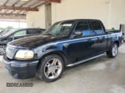 ✅ 2003 Ford F-150 Harley-Davidson • VIN: 1FTRW07383KD63595 • Lot: 59922725. Listed on Copart with 130,837 mi. Free auction sales archive from the USA and detailed vehicle history report at DreamBid. Image 1.