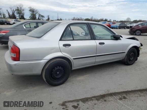 ✅ 2001 Mazda Protege DX • VIN: JM1BJ222310425181 • Lot: 88560255. Wystawiony na Copart z przebiegiem 201 942 mil. Bezpłatny archiwum sprzedaży aukcyjnych z USA i szczegółowy raport historii pojazdu na DreamBid. Zdjęcie 3.