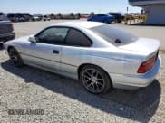 ✅ 1997 BMW 8 Series • VIN: WBAEF8328VCC31637 • Lot: 56166825. Listed on Copart with 153,784 mi. Free auction sales archive from the USA and detailed vehicle history report at DreamBid. Image 2.