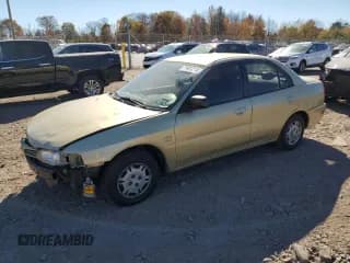 ✅ 1997 Mitsubishi Mirage • VIN: JA3AY36A9VU027615 • Lot: 77401214. Wystawiony na Copart z przebiegiem 104 407 mil. Bezpłatny archiwum sprzedaży aukcyjnych z USA i szczegółowy raport historii pojazdu na DreamBid. Zdjęcie 1.