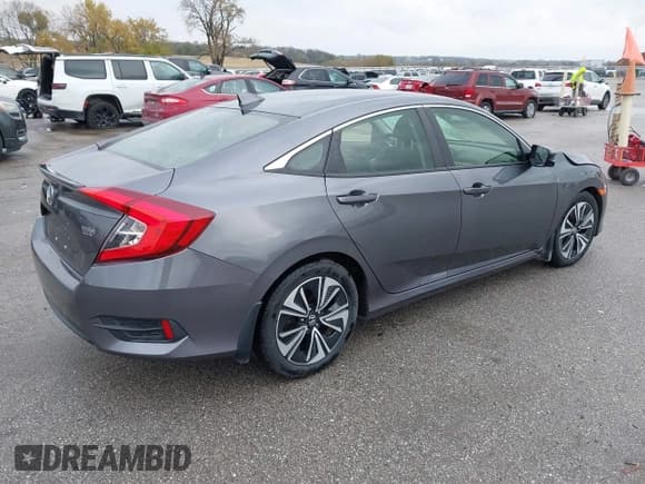 ✅ 2018 Honda Civic EX-T • VIN: JHMFC1F30JX043947 • Lot: 43563584. Listed on IAAI with 145,000 mi. Free auction sales archive from the USA and detailed vehicle history report at DreamBid. Image 4.