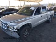 ✅ 2003 Dodge Dakota SLT • VIN: 1D7HL48N13S294573 • Lot: 41291127. Wystawiony na IAAI z przebiegiem 227 355 mil. Bezpłatny archiwum sprzedaży aukcyjnych z USA i szczegółowy raport historii pojazdu na DreamBid. Zdjęcie 2.