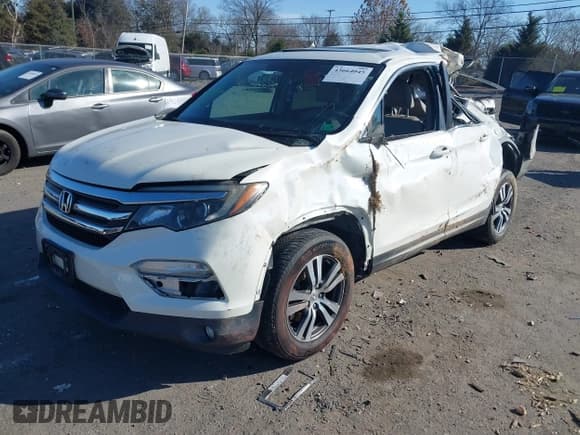 ✅ 2017 Honda Pilot EX-L • VIN: 5FNYF6H5XHB098584 • Lot: 43664045. Listed on IAAI with 119,767 mi. Free auction sales archive from the USA and detailed vehicle history report at DreamBid. Image 2.