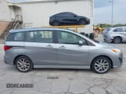 ✅ 2014 Mazda 5 Touring • VIN: JM1CW2CL7E0175902 • Lot: 43287647. Listed on IAAI with 98,037 mi. Free auction sales archive from the USA and detailed vehicle history report at DreamBid. Image 13.