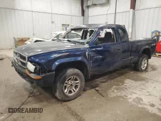 2003 Dodge Dakota Sport z VIN 1D7HG32N43S328884, wystawiony jako Copart lot #85985644 z przebiegiem 141 779 mil mil oraz Nie do naprawy • Non repairable. Historia ofert i sprzedaży dostępna na DreamBid. Obrazek 1.